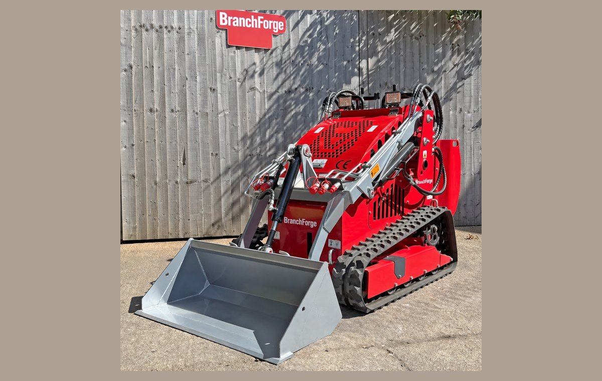 Mini skid steer front three-quarter view on rubber tracks